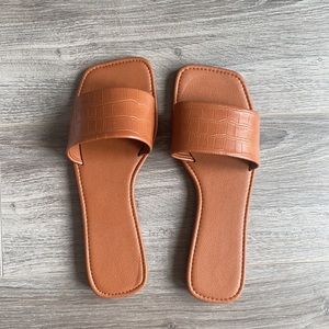 Brown slip on sandals